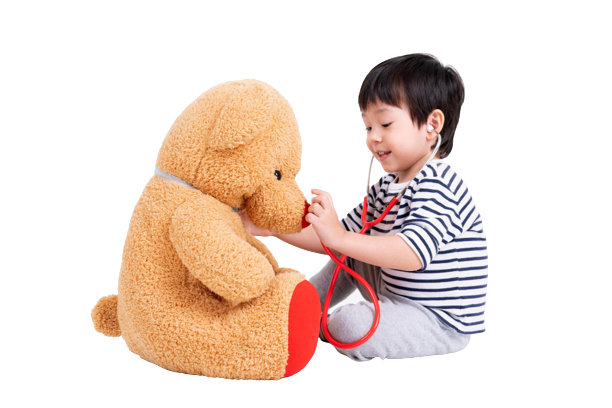 little-boy-playing-doctor-with-teddy-bear-removebg-preview